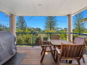 Balcony with outdoor dining setting and foreshore views to park and ocean
