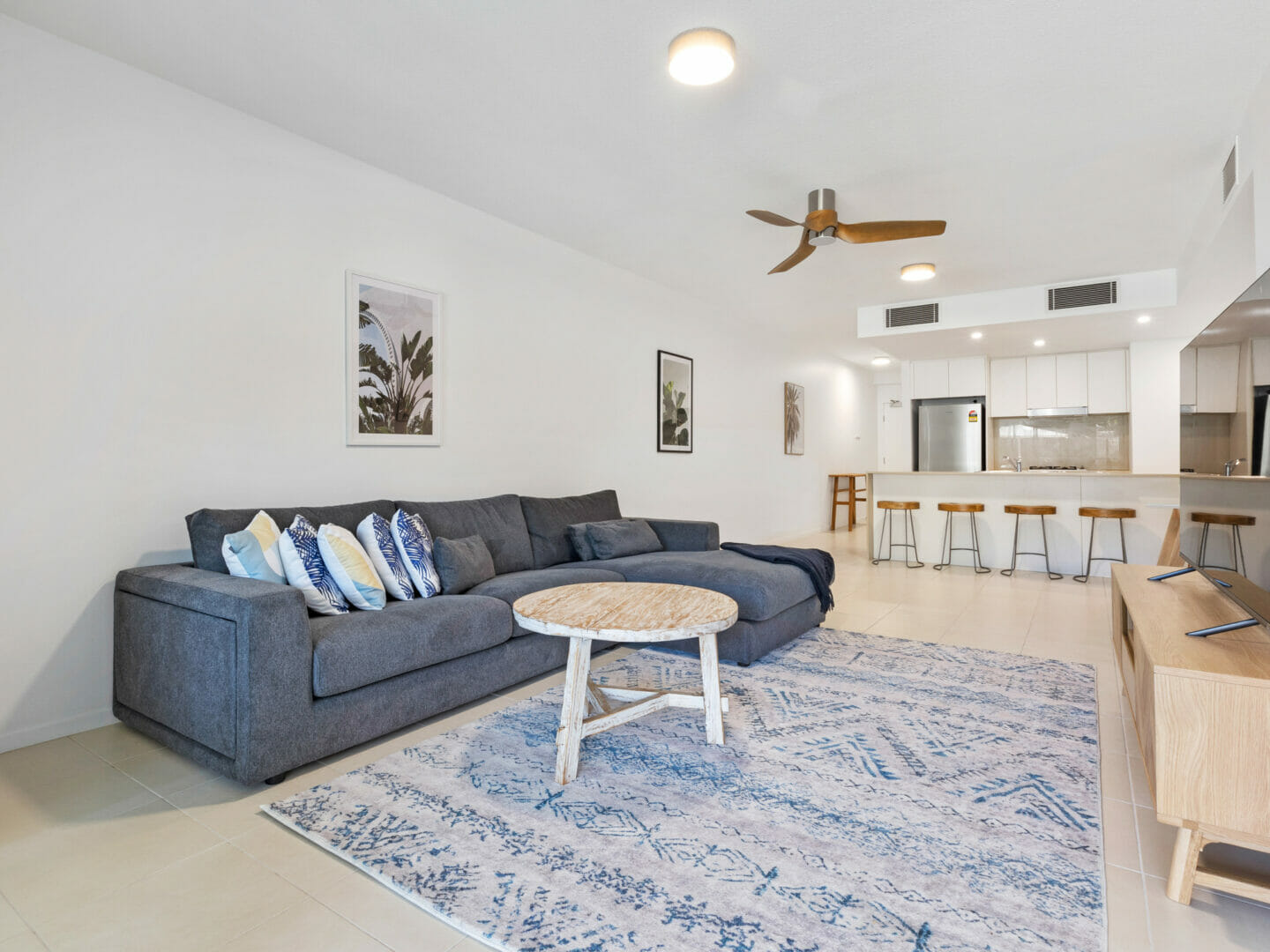 Living room with modular lounge, coffee table and rug